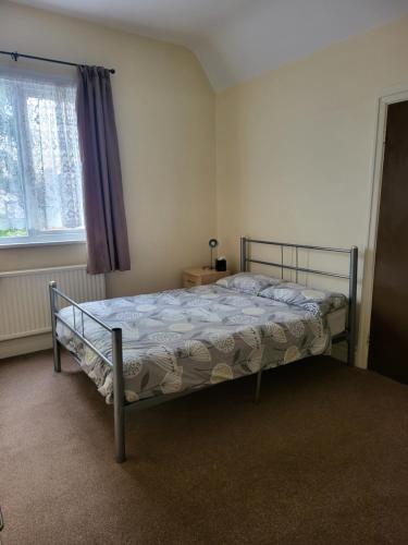 a bedroom with a bed and a window at The Jolly Sailor in Scalby