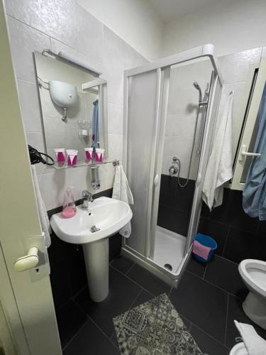 a bathroom with a sink and a shower at Tufaro B&B Private Room in Macerata Campania