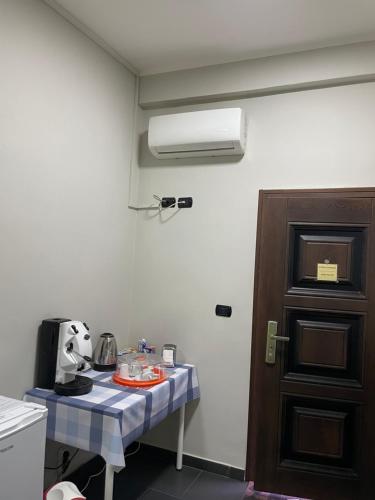 a room with a table with a coffee maker on it at Tufaro B&B Private Room in Macerata Campania