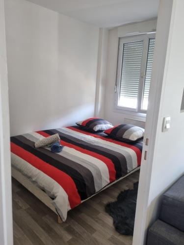 Ein Bett oder Betten in einem Zimmer der Unterkunft Maison de ville proche gare RER D
