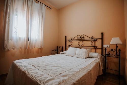 Giường trong phòng chung tại Conde de la Encina 16