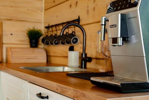 a kitchen with a coffee maker on a counter at Domek w Górach in Piwniczna-Zdroj