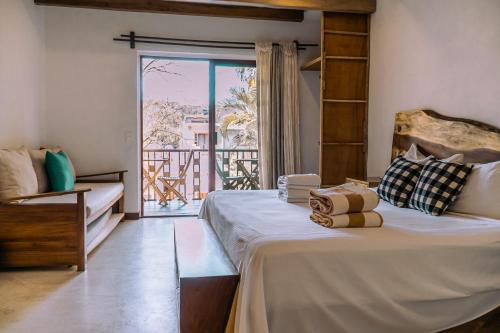 Postel nebo postele na pokoji v ubytování Hotel de Asis