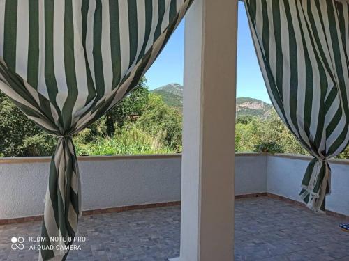 a room with a window with a view of mountains at Casa Vacanze Gio&le in Domusnovas