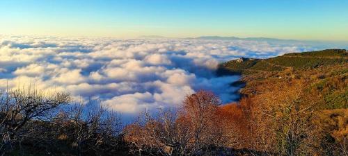 a view of clouds in the sky from a mountain at Chania Hotel in Chania
