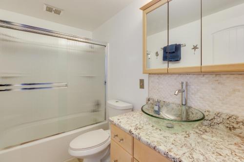 a bathroom with a sink and a toilet and a shower at West Beach Retreat in Oak Harbor