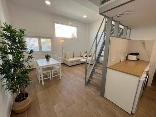 a room with a kitchen and a living room at MiniLoft #Baiona / in Baiona