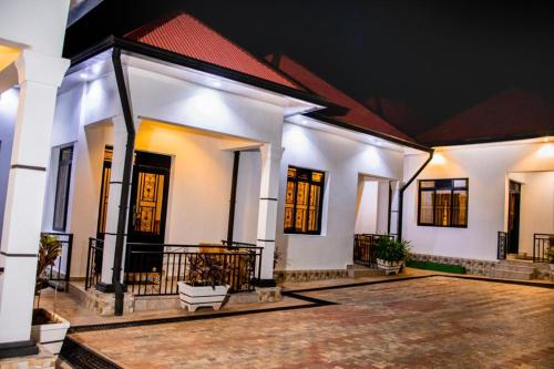 a courtyard of a house at night at B I G Residence Hotel in Bujumbura