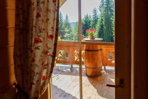 a view of a balcony with a table and a window at Leśna Bacówka in Nowy Targ