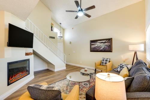 a living room with a couch and a fireplace at Dog-Friendly Yard! North Phoenix Family Retreat in Phoenix
