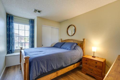 a bedroom with a bed and a mirror and a window at Dog-Friendly Yard! North Phoenix Family Retreat in Phoenix