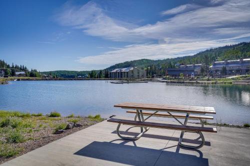 a picnic table sitting next to a lake at Ski-InandSki-Out Brian Head Condo with Hot Tub! in Brian Head