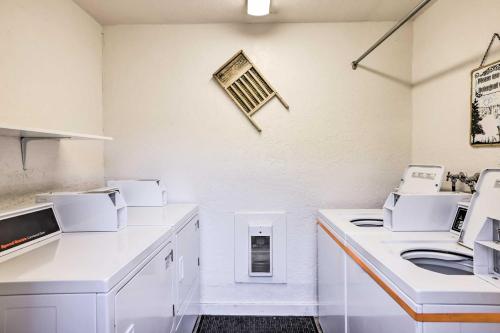 a kitchen with white counters and white appliances at Ski-InandSki-Out Brian Head Condo with Hot Tub! in Brian Head
