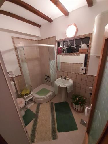 a small bathroom with a toilet and a sink at Bajka in Valjevo