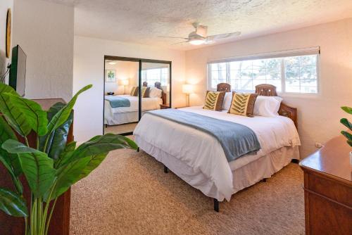 a bedroom with a bed and a large mirror at CB-5515 - Surfer's Paradise in Carlsbad