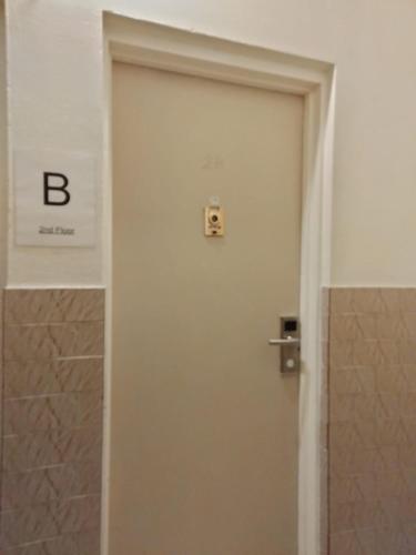 a door in a bathroom with a sign on it at 2B CLOSe in New York