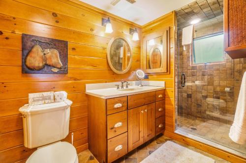 a bathroom with a toilet and a shower and a sink at Platte Lake Paradise in Beulah