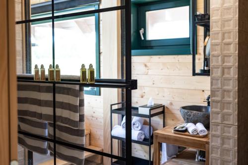 a bathroom with a sink and a mirror at River House Moon in Gospić