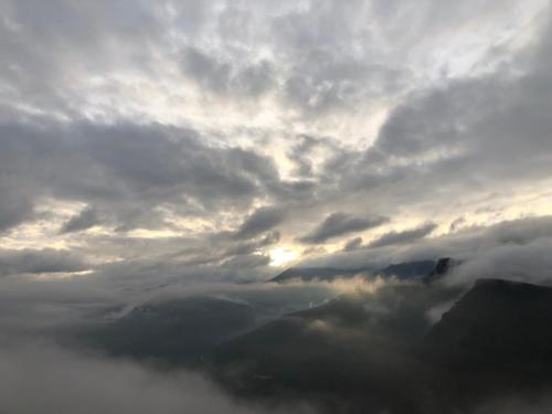 a cloudy sky with a view of a mountain at A Barreira -Lar da cima- in Folgoso