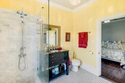 a bathroom with a shower and a sink and a toilet at Historic Savannah Home with Outdoor Grill, Patio in Savannah