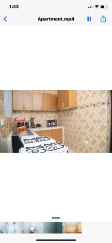 a screenshot of a kitchen with a stove top oven at Extended stay suite, Tema. in Ashaiman