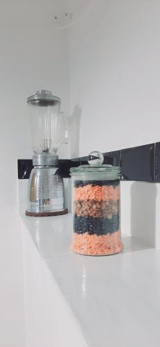 a food processor and a jar of food on a counter at Casa Lale in Corchiano