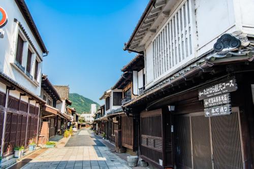 a street in an old town with buildings at Tabist Setouchinoyado Takehara Seaside in Takekara