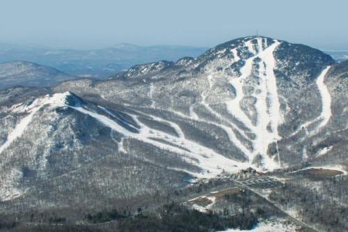 a snow covered mountain with a ski trail on it at Grands Espaces Orford 115 condo/chalet in Orford