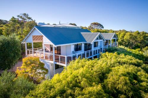 a house on top of a hill with trees at Sea Spell I Private Properties in Dunsborough