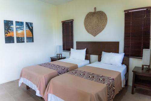 Una cama o camas en una habitación de Kasagpan