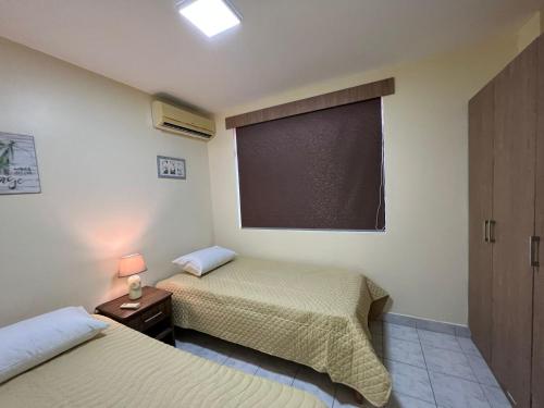 Ένα ή περισσότερα κρεβάτια σε δωμάτιο στο Departamento Ocaso
