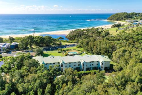 an aerial view of a resort with the beach at Fathoms 9 in Mollymook