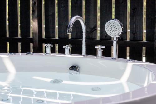 a bathroom sink with a fan on top of it at Villa Noël Hakone Fuji Sauna&Open Air Bath in Hakone