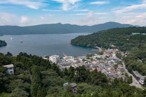 a view of a town next to a body of water at Villa Noël Hakone Fuji Sauna&Open Air Bath in Hakone