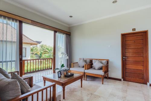 Χώρος καθιστικού στο Desa Swan Villas & SPA, Keramas