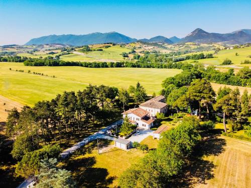an aerial view of a home with mountains in the background at B&B Villa Incrocca in Cerreto dʼEsi