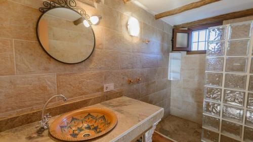 a bathroom with a sink and a mirror at Villa Sol Alozaina by Ruralidays in Alozaina