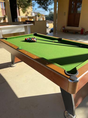 a pool table with a green cloth on it at La massaria di Cesare in Pianella