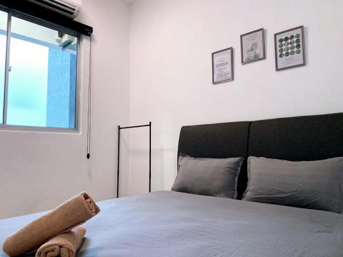 a bedroom with a bed with a teddy bear on it at JOVIAL Modern Cozy Suite `Metropol BM BandarPerda in Bukit Mertajam