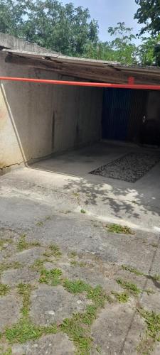 a concrete garage with a red line on top of it at Hortensia in Buje