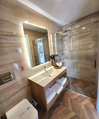 a bathroom with a sink and a shower at Villa No 44 in Darıca