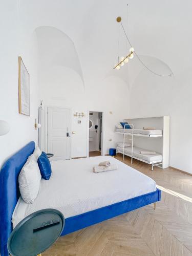 A bed or beds in a room at Alto Borgo Rooms