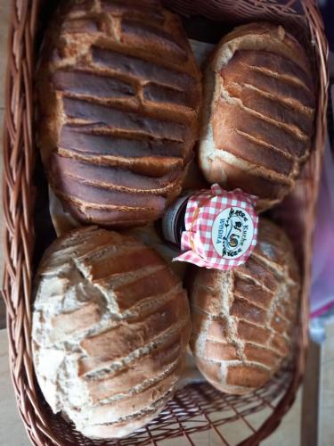 a basket full of breads with a sucker at Pole namiotowe - namiot do wynajęcia - Kurka Wodna !!! in Mikołajki