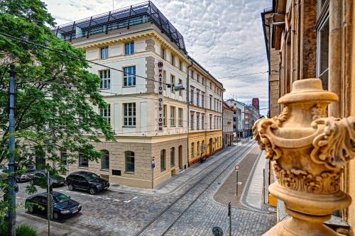 a fire hydrant on a city street with buildings at Old Town Haston in Wrocław