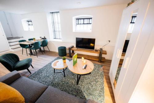 a living room with a couch and a table at Charming 60m2 One-Bedroom Apartment - WE39B in Tiel