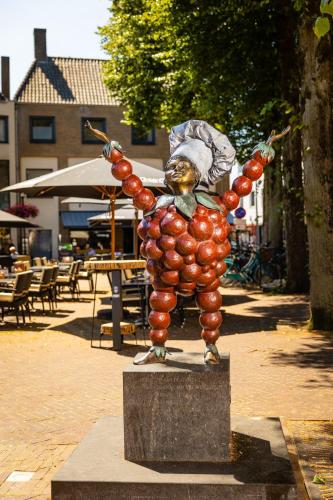 a statue of a person made out of fruit at Friendly 50m2 One-Bedroom Apartment - WE39A in Tiel