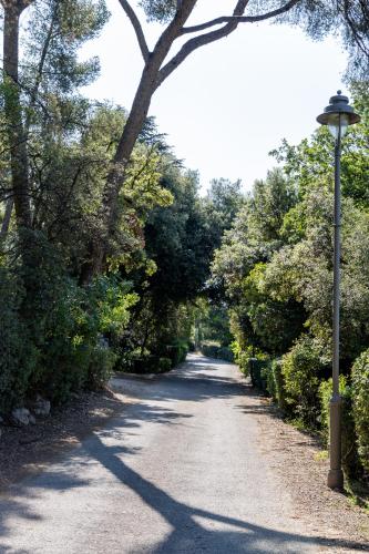 a street light on the side of a road at The Originals City, Hôtel Côté Sud, Marseille Est in Allauch