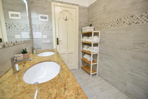 a bathroom with two sinks and a shower at Villa Sunshine Positano Room in Positano