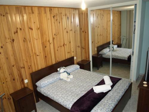 a bedroom with two beds with a teddy bear on them at ¡¡ Una casa pensada para evadirse y disfrutar !! in Batres