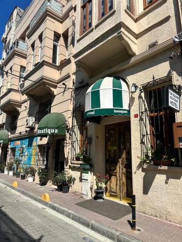 a building with an awning on the side of a street at Tom Square Boutique Hotel in Istanbul